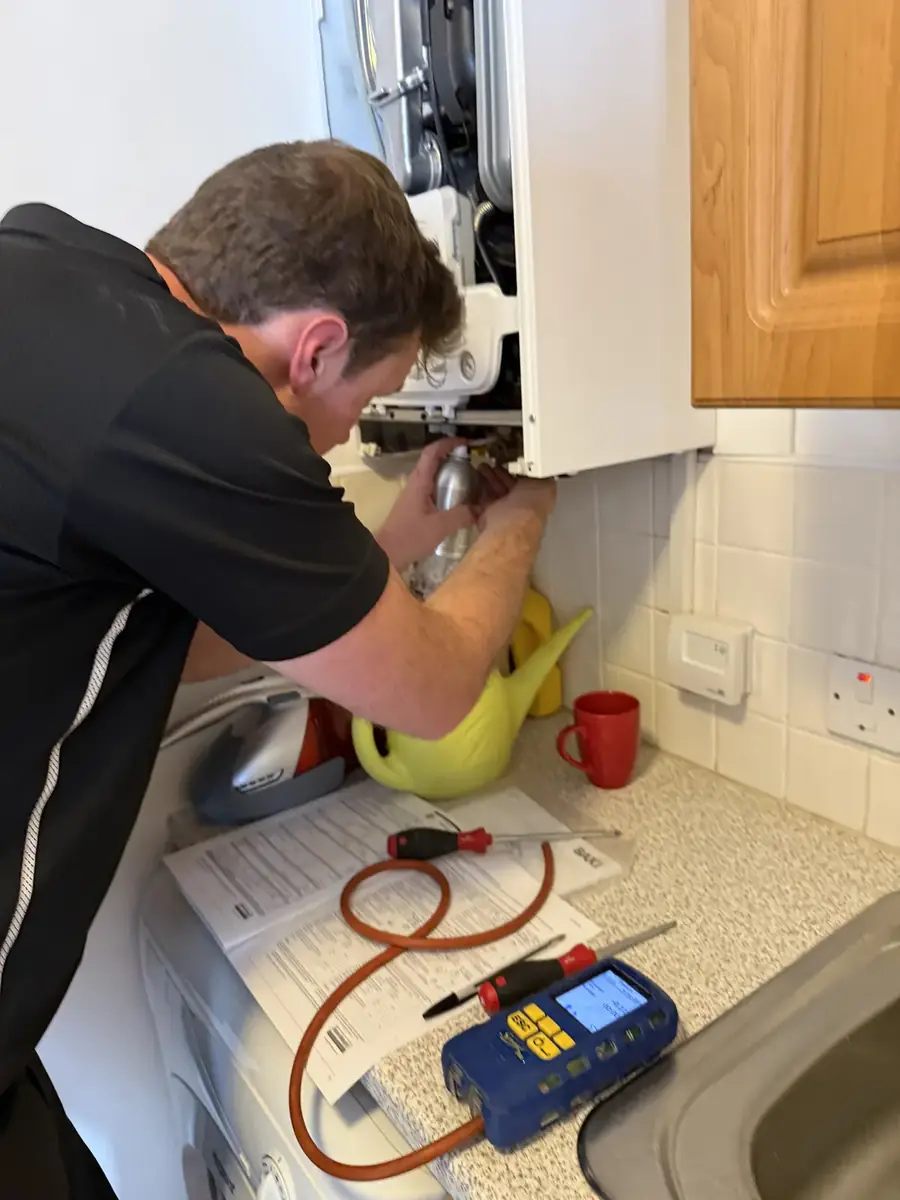 Boilers Done Right engineer testing a boiler with a flue gas analyser during a service